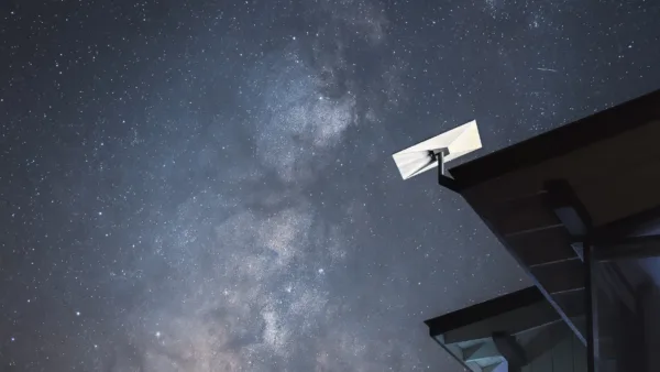 Starlink's official residential image of its standard dish under a night sky